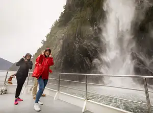 Milford-Sound-Nature-Cruise-cruising-into-the-Stirling-Falls-screen.jpg